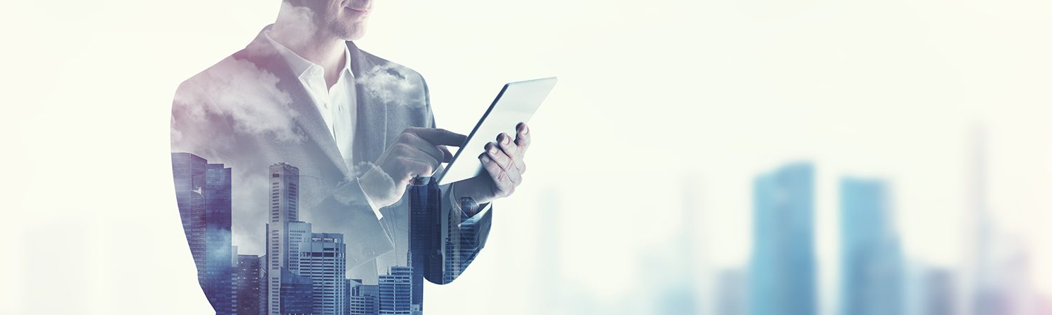 An unrecognizable man uses a iPad table