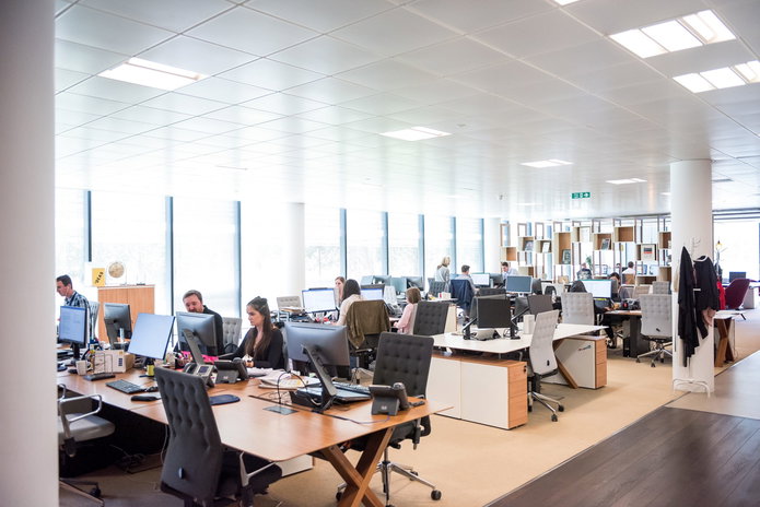 open office space with people working at computers
